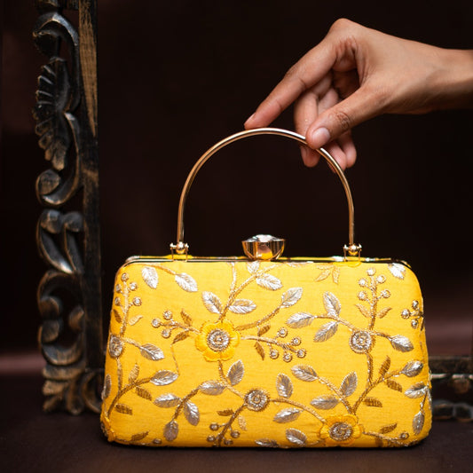 Yellow embroidered handle clutch