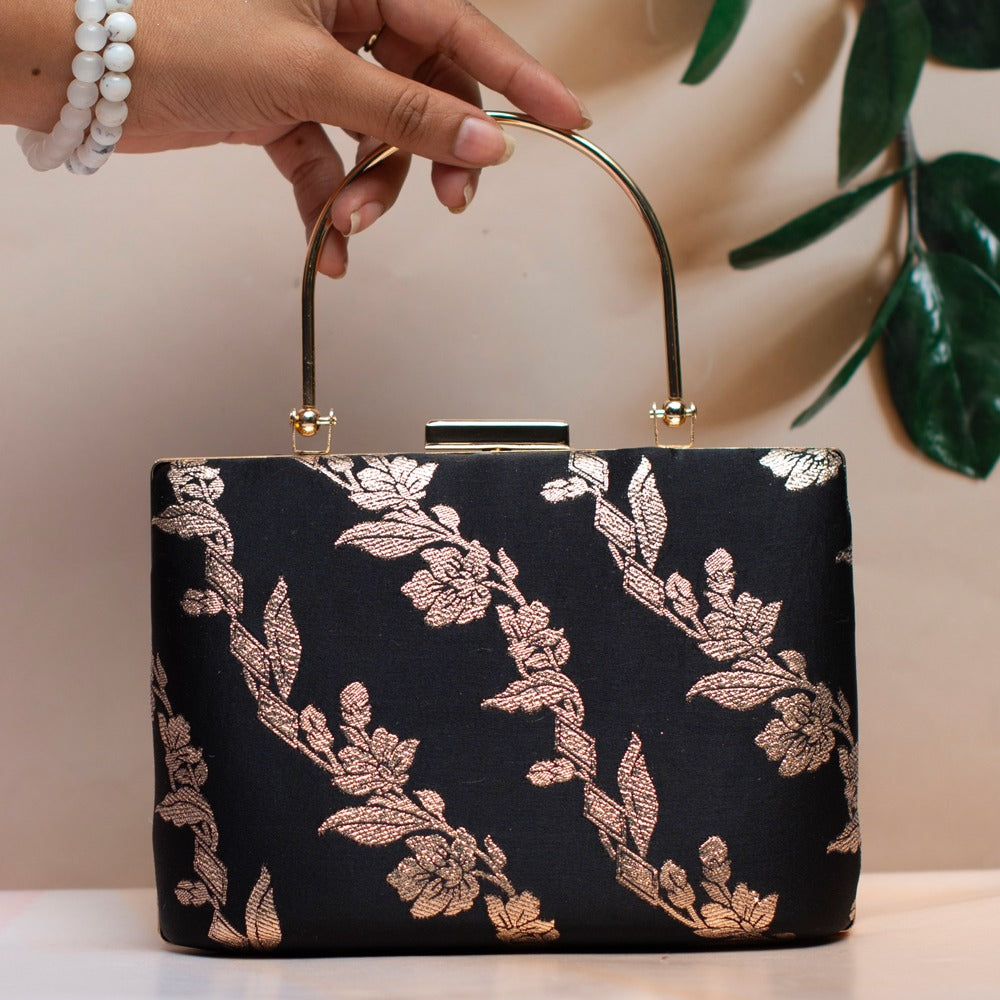 Brocade handle clutch - black foil leaves